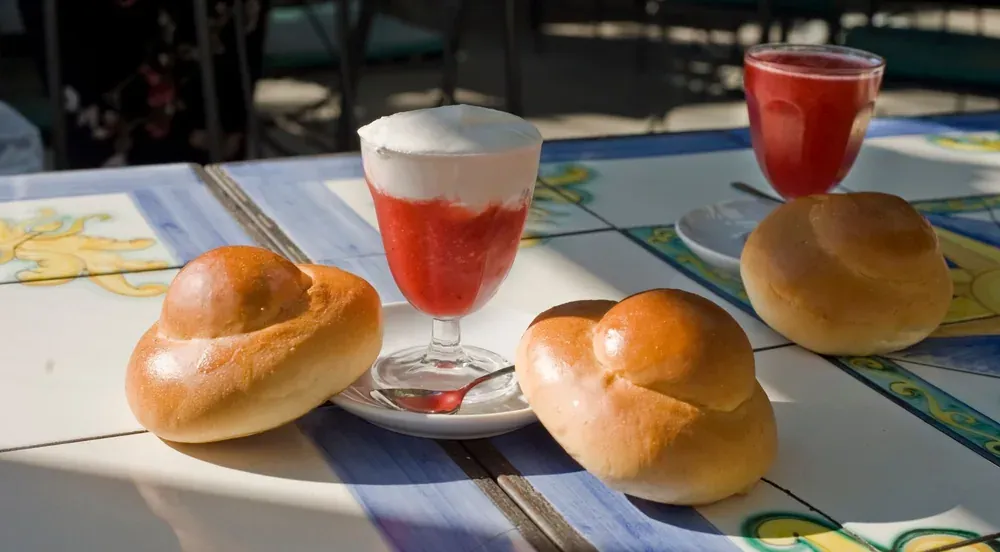 Almond granita served with a brioche col tuppo