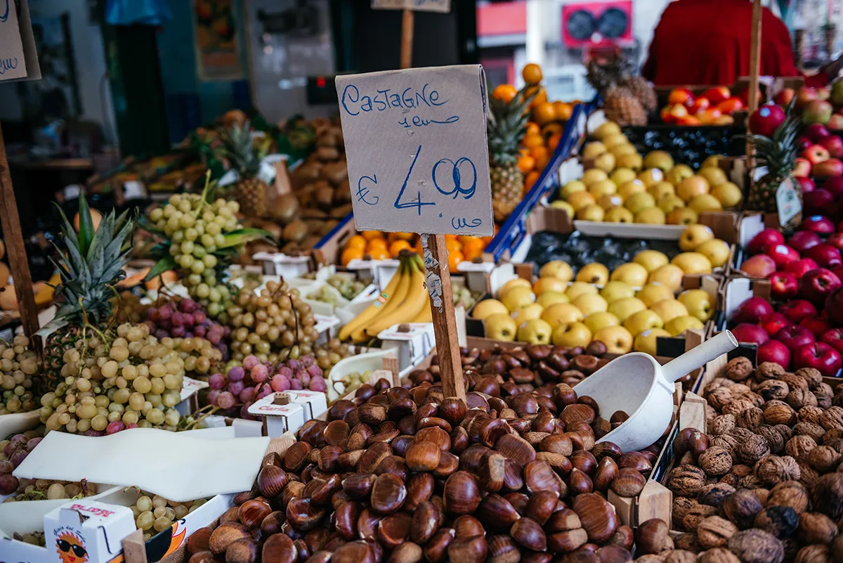 Roasted chestnuts and autumn fruit at a Palermo market stall