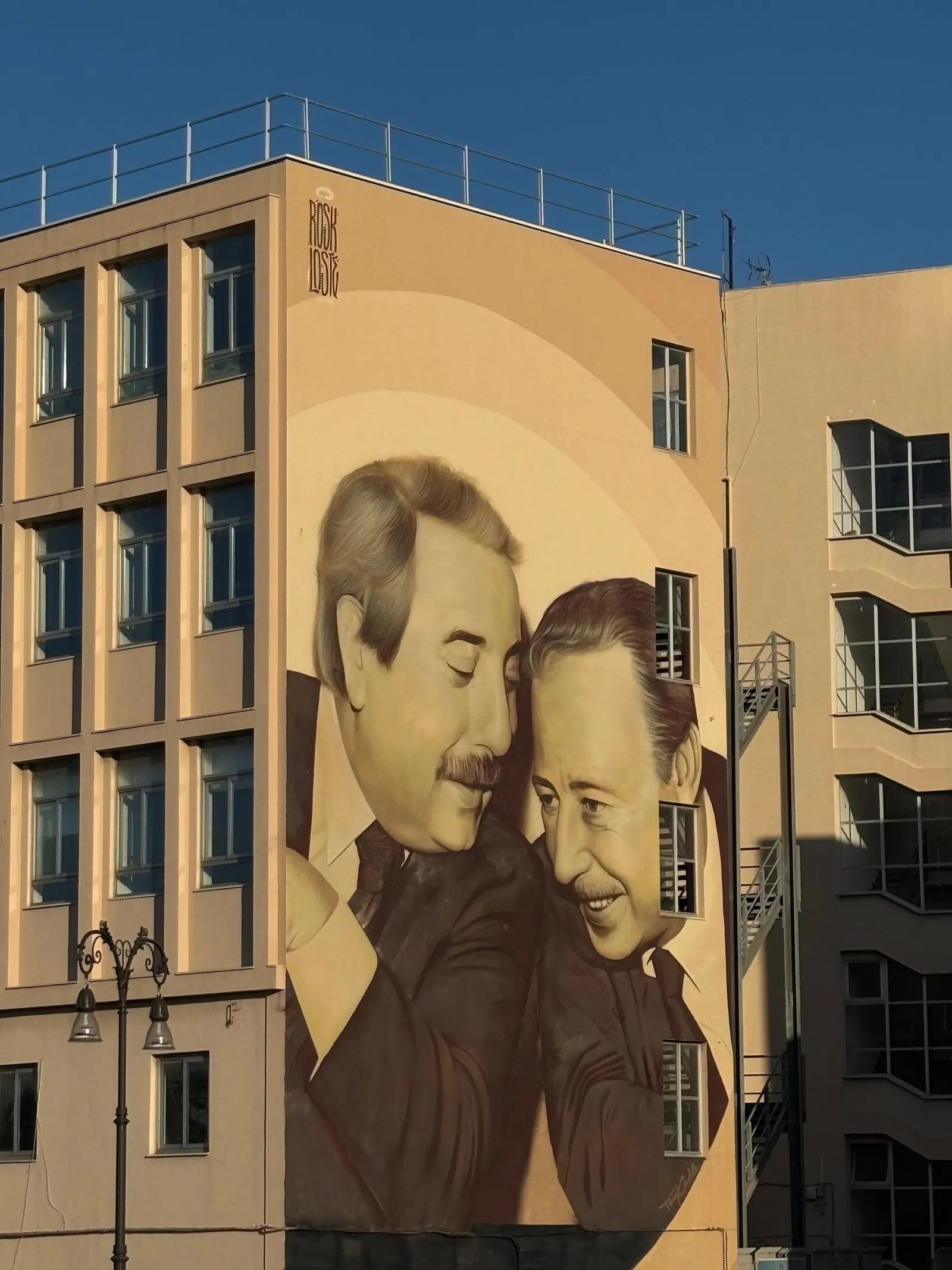 The mural of judges Falcone and Borsellino on a building wall