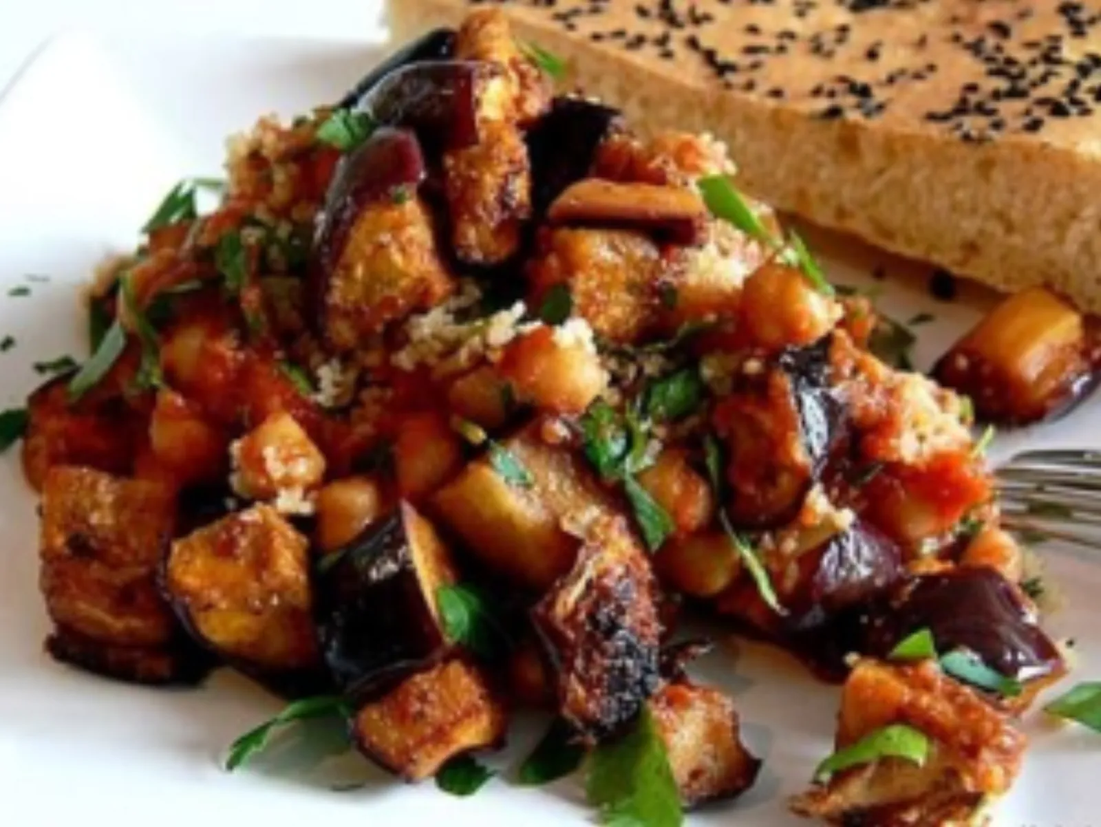 Caponata of fried aubergine on a plate
