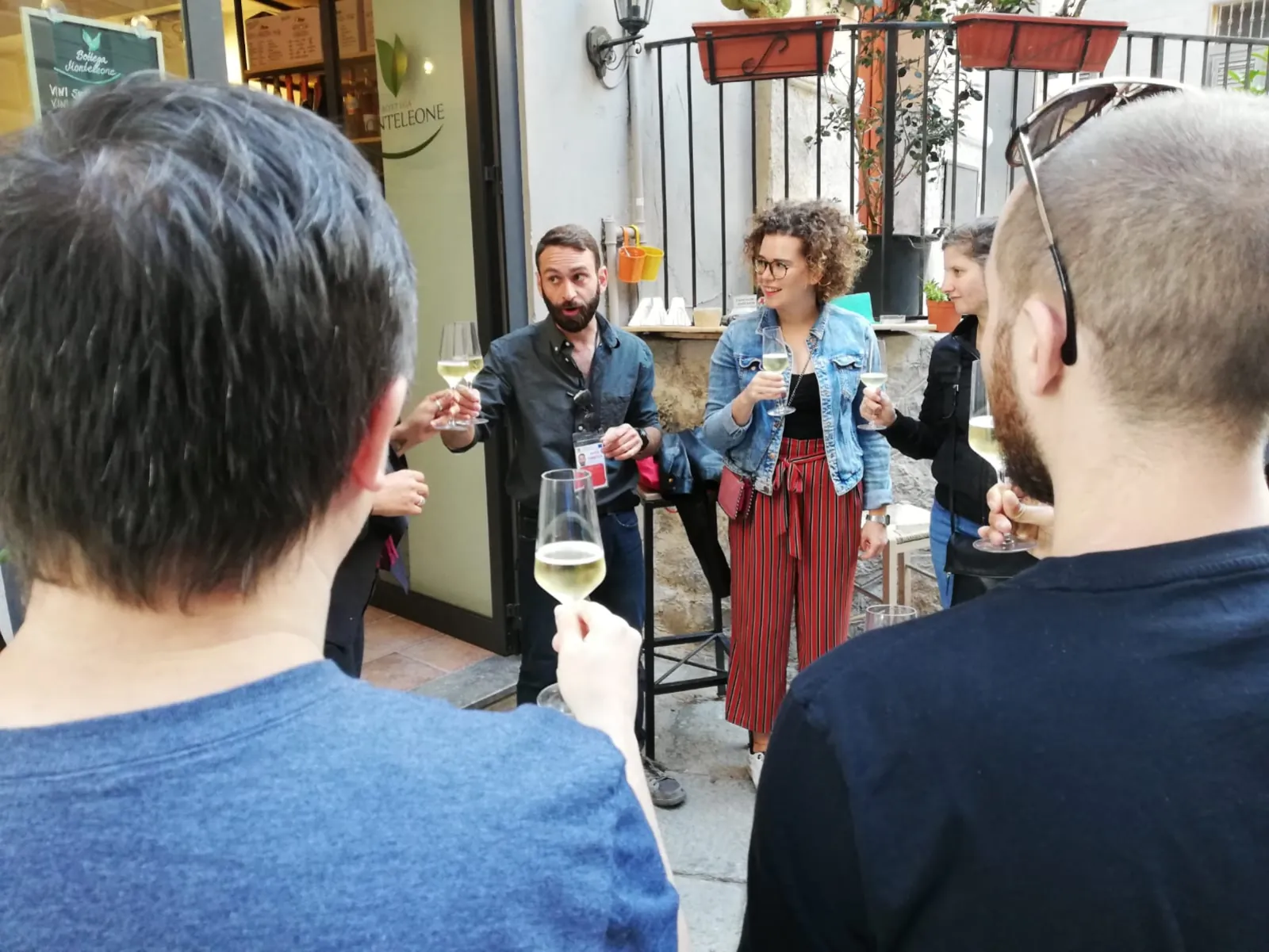 Guests raise glasses of wine at an evening stop