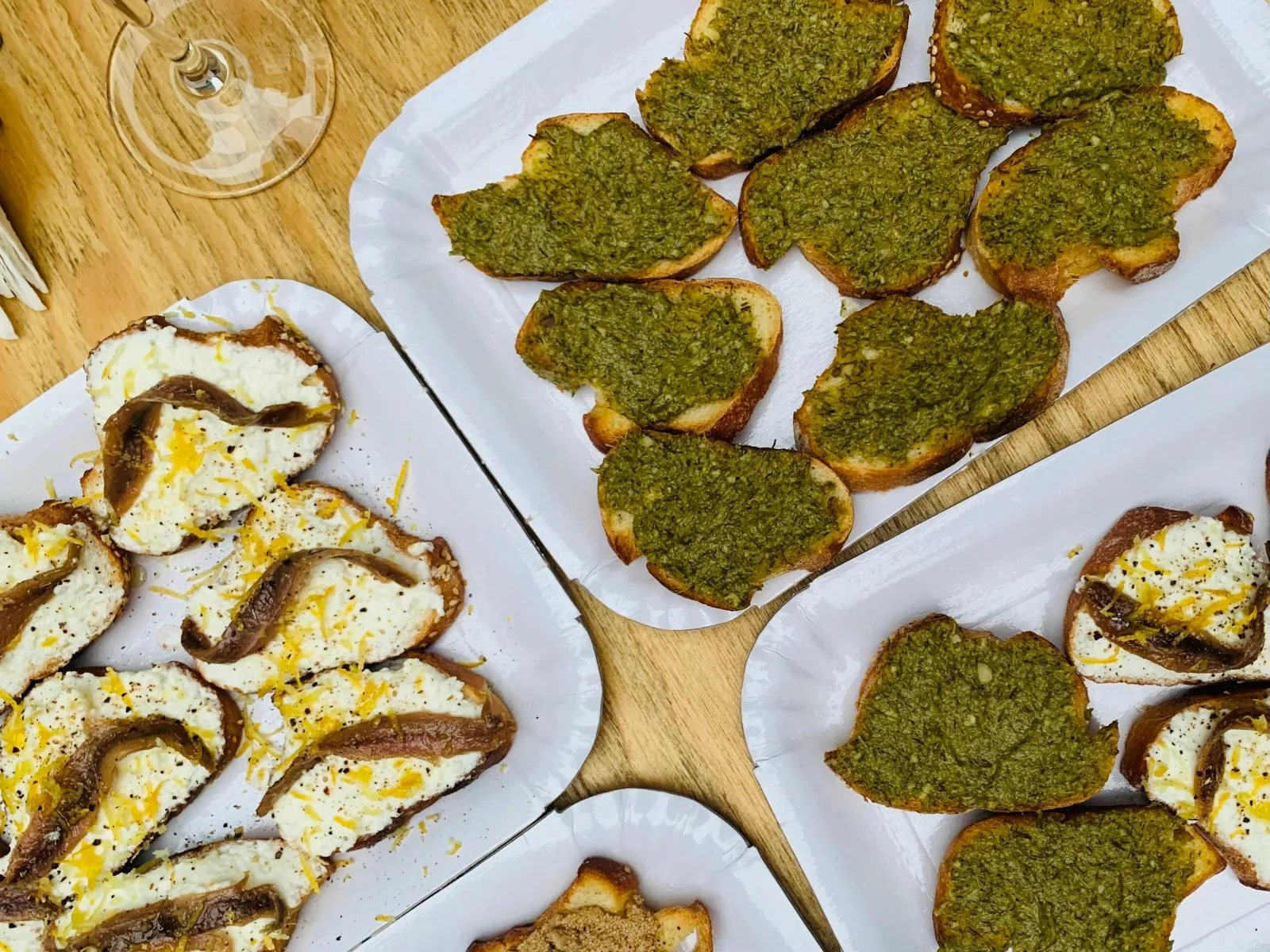 Bruschetta with pistachio pesto and ricotta served with wine