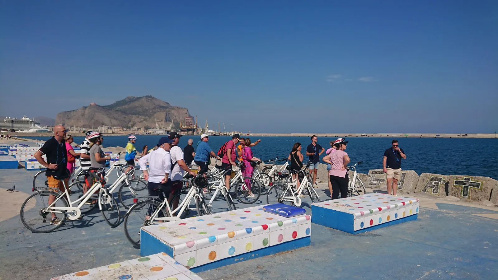 The group with bikes on the seafront, Monte Pellegrino behind
