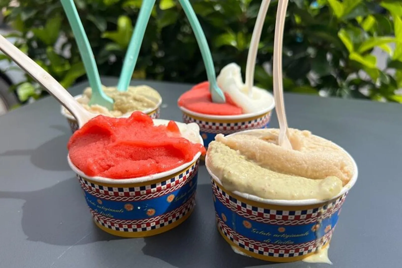 Cups of granita and gelato in different flavours