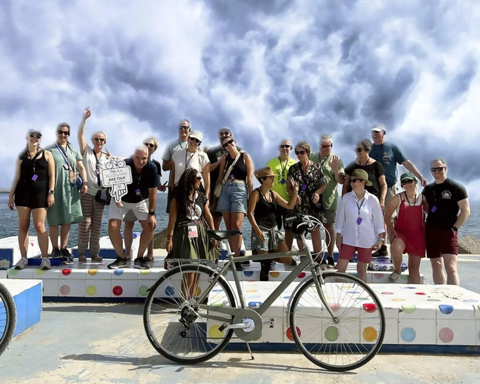Riders posing with their bikes on the seafront at Foro Italico