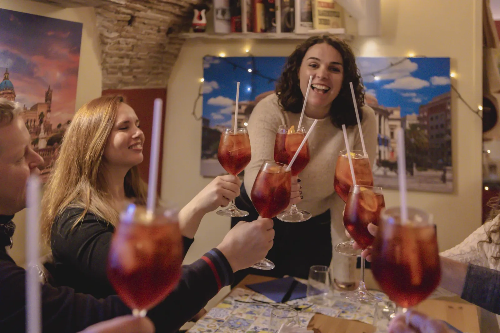 Guests toasting with spritz glasses