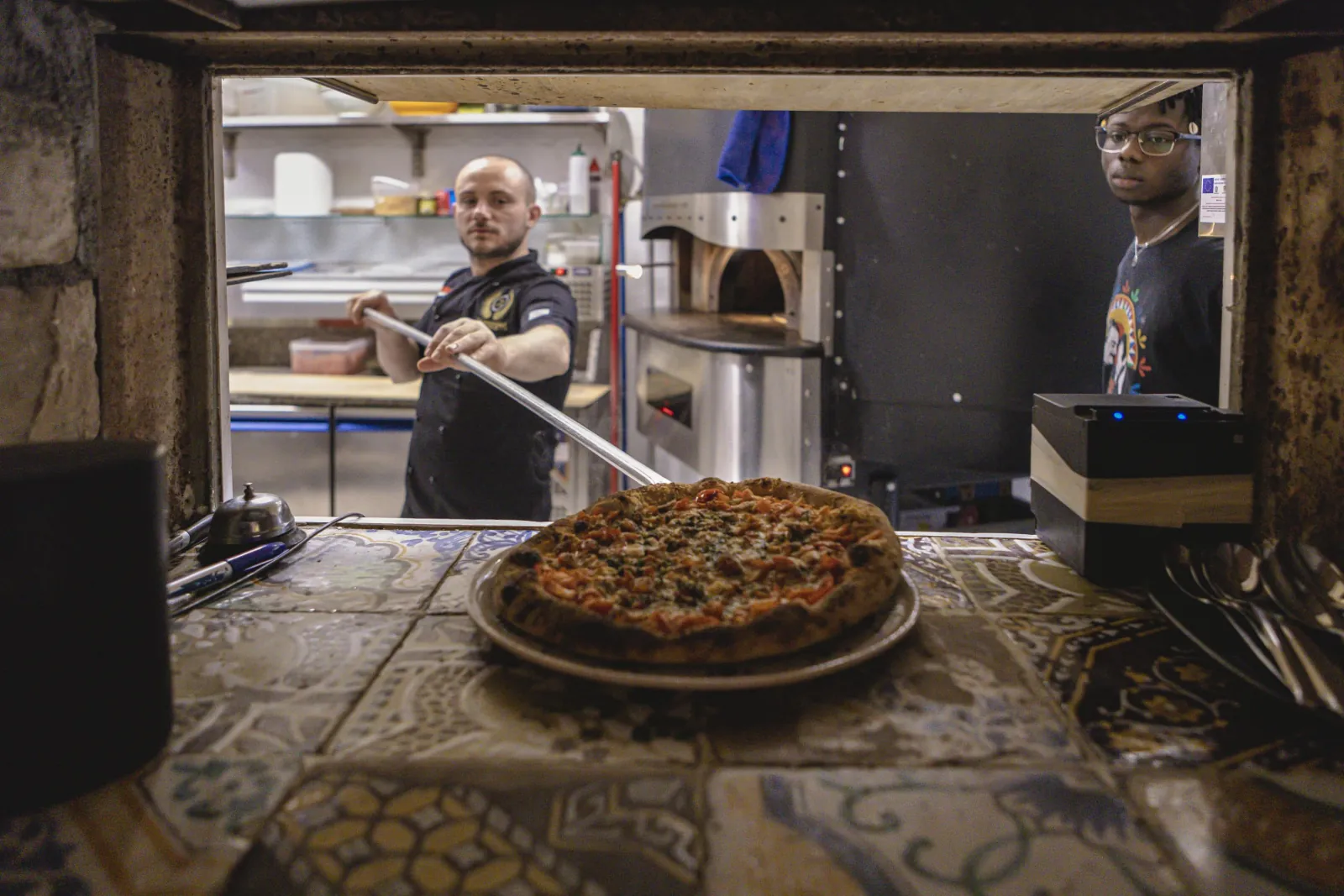 A pizza fresh from the wood oven