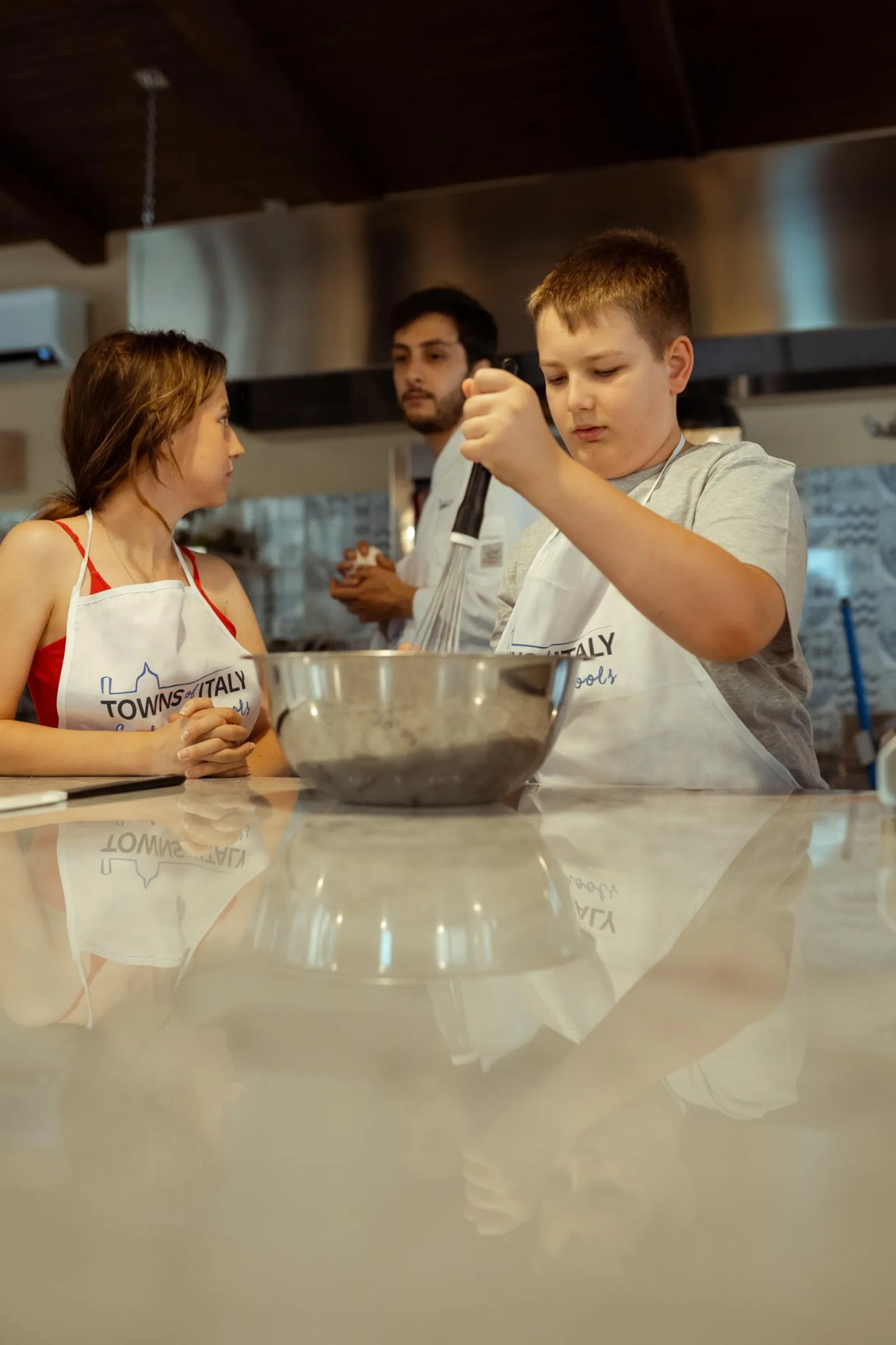 A young guest cooking at the class