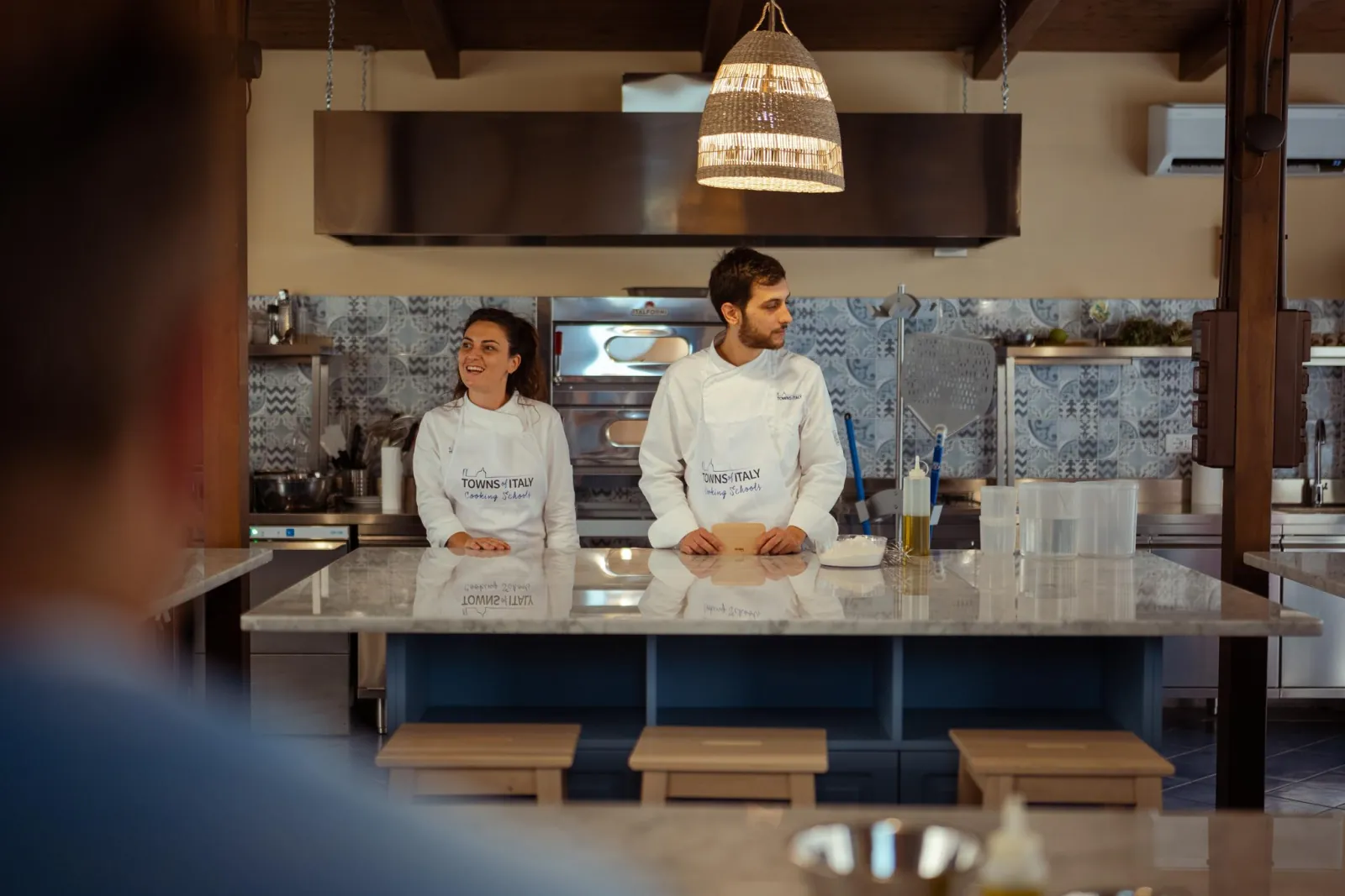 Two chefs ready to start the class at the cooking school